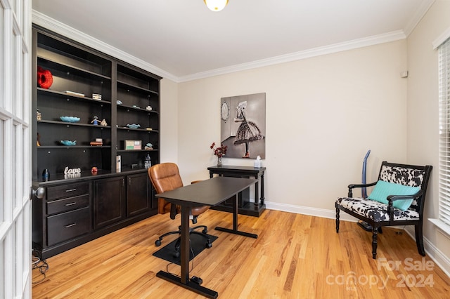 office area with ornamental molding and light wood-type flooring