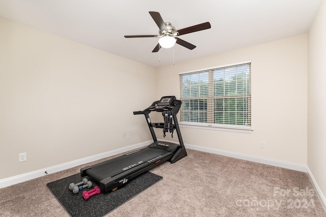 workout area with light carpet and ceiling fan