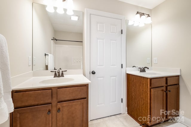 bathroom with tile patterned flooring and vanity