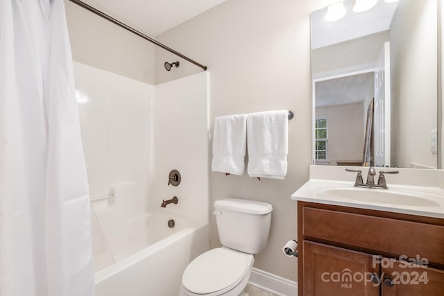 full bathroom with shower / tub combo, vanity, and toilet