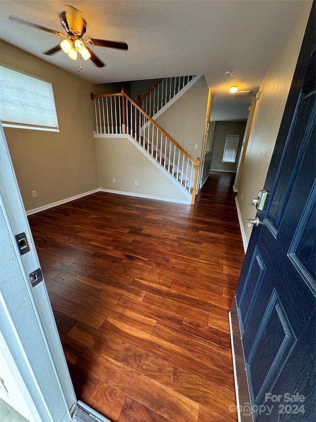 foyer featuring ceiling fan and dark hardwood / wood-style floors