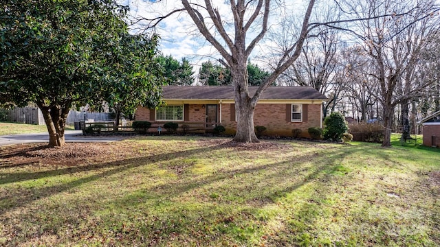 single story home featuring a front lawn