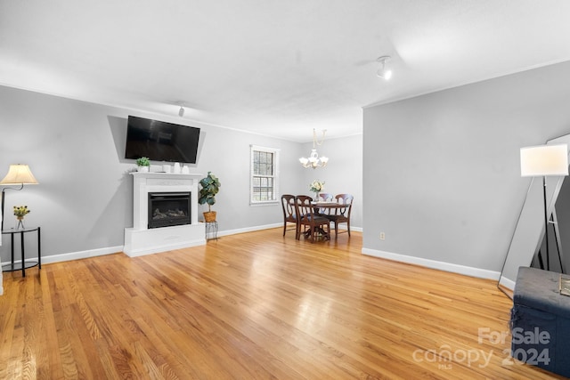 living room featuring hardwood / wood-style floors and a notable chandelier