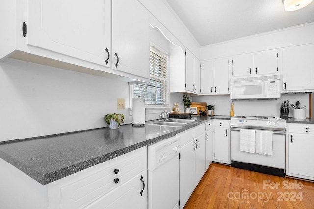 kitchen featuring light hardwood / wood-style floors, white cabinetry, white appliances, and sink