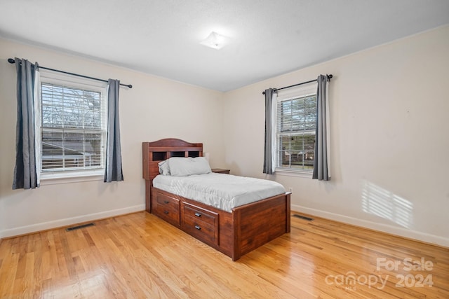 bedroom featuring light wood-type flooring