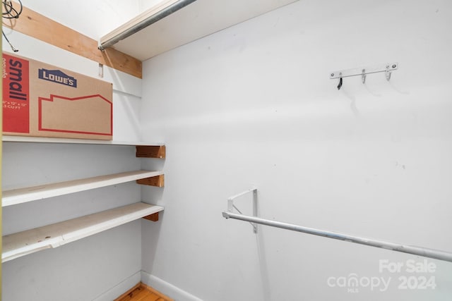 spacious closet featuring hardwood / wood-style flooring