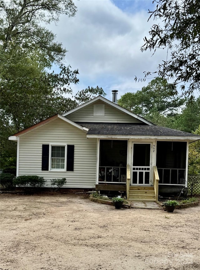 view of front of home with a sunroom