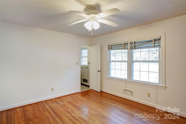 spare room with light hardwood / wood-style flooring and ceiling fan