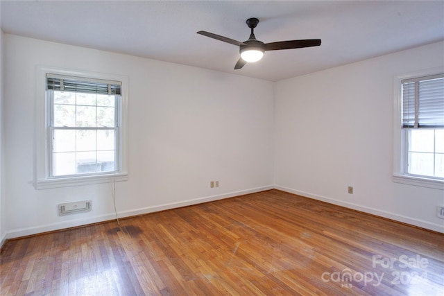 empty room featuring light hardwood / wood-style flooring and ceiling fan