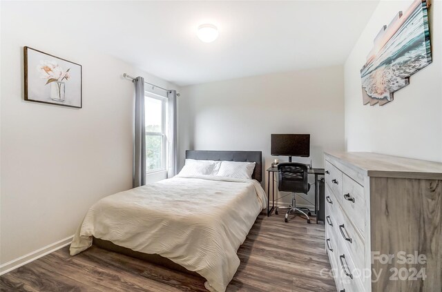 bedroom featuring dark hardwood / wood-style floors