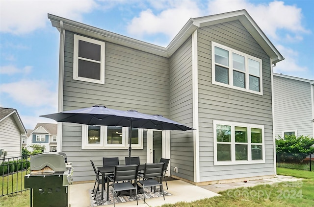 back of house with a patio area