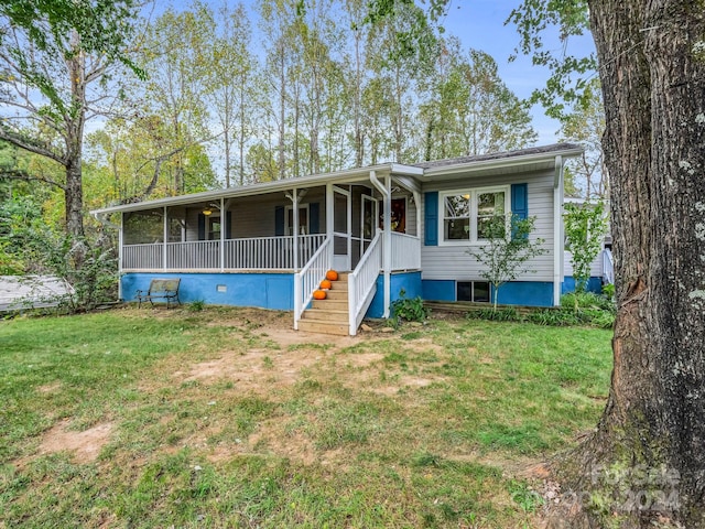 view of front of house with a porch and a front lawn