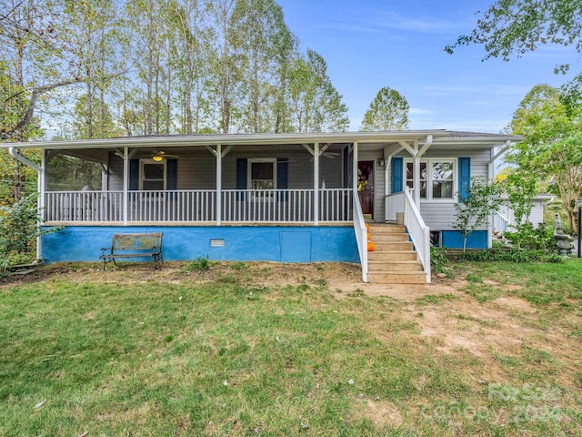 view of front of house with a front yard and covered porch