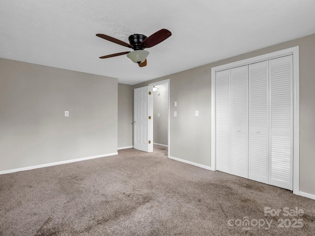 200 Frost Rd, Saluda, NC 28773 - unfurnished bedroom with carpet, baseboards, a closet, and ceiling fan