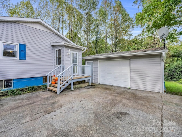 200 Frost Rd, Saluda, NC 28773 - view of front of property featuring an outbuilding, driveway, and a garage