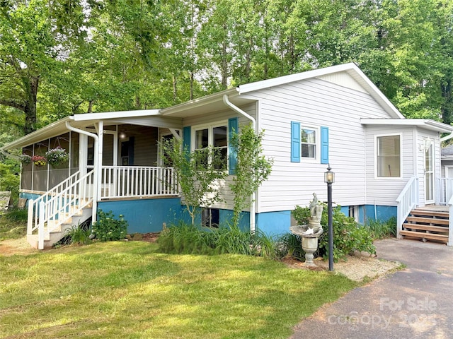 200 Frost Rd, Saluda, NC 28773 - view of front of property featuring a porch and a front lawn