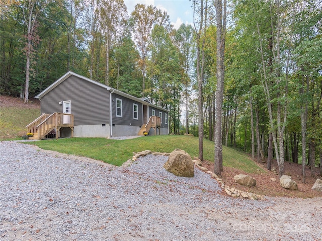 view of home's exterior with a lawn