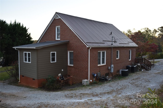 back of property featuring central air condition unit