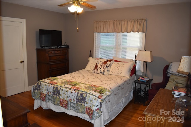 bedroom with hardwood / wood-style floors and ceiling fan