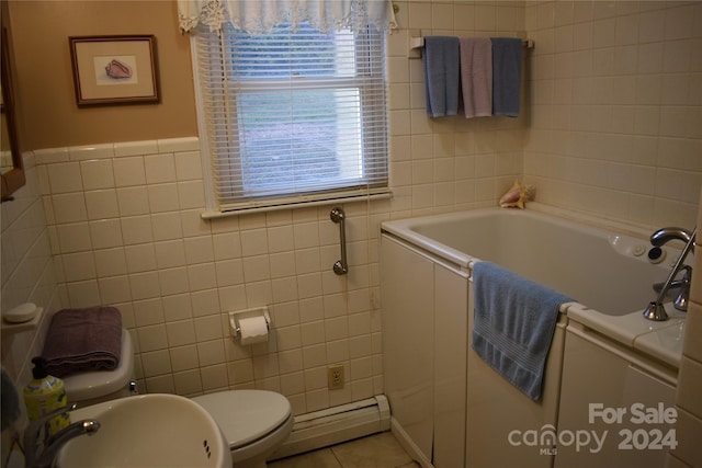 bathroom with toilet, a baseboard radiator, sink, tile walls, and a bath