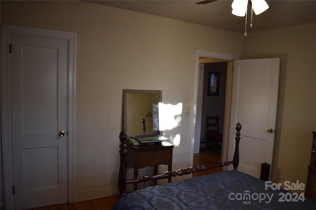 bedroom featuring dark hardwood / wood-style flooring and ceiling fan