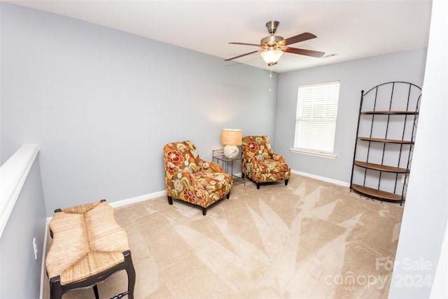 sitting room with carpet floors and ceiling fan