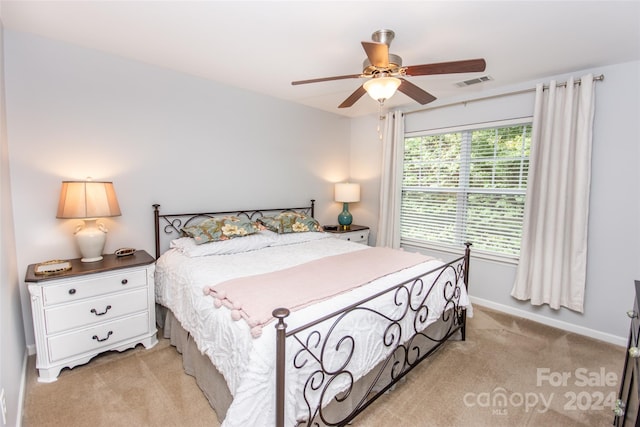 bedroom featuring ceiling fan and light colored carpet