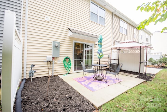 back of house featuring a patio and a gazebo