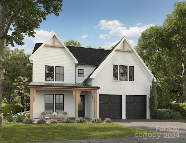 modern farmhouse style home featuring a garage, a front lawn, and covered porch