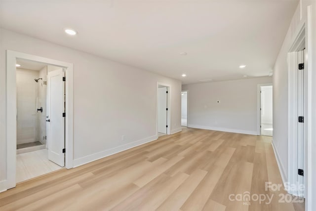 spare room with light hardwood / wood-style flooring