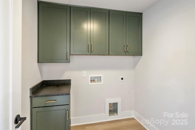 laundry area with cabinets, electric dryer hookup, washer hookup, and light wood-type flooring