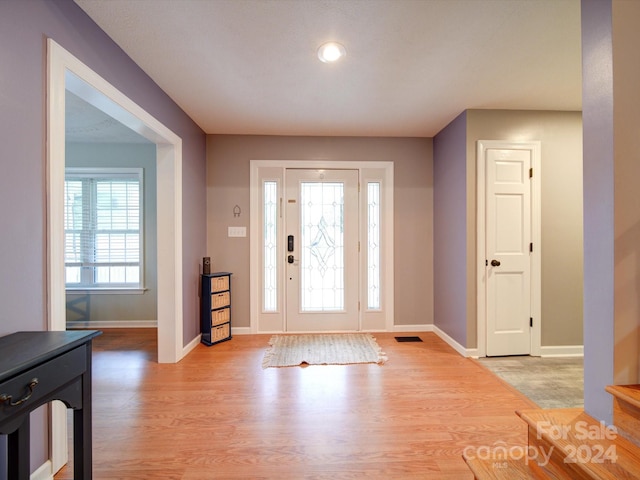 entrance foyer featuring light hardwood / wood-style floors