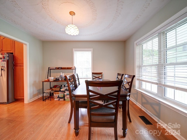 dining space featuring light hardwood / wood-style flooring