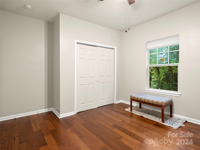 interior space featuring ceiling fan and dark hardwood / wood-style floors