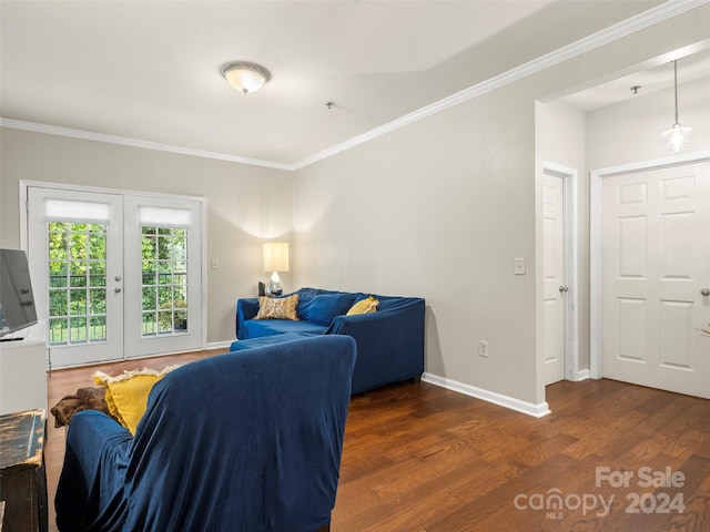 living room featuring french doors, ornamental molding, and dark wood-type flooring