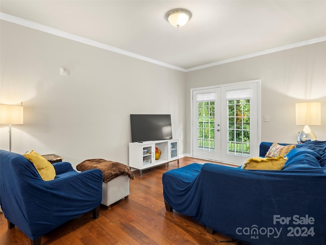 living room with ornamental molding, dark wood-type flooring, and french doors