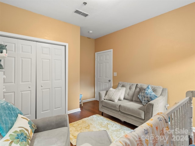 living room featuring dark wood-type flooring