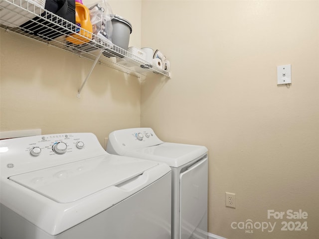 washroom featuring washing machine and dryer