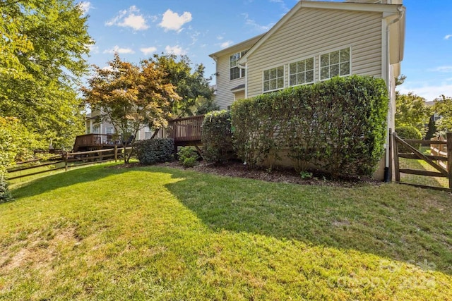 view of yard with a wooden deck