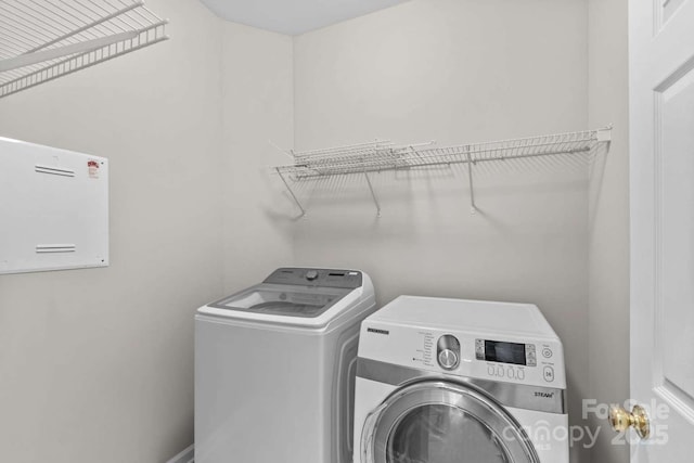 washroom with independent washer and dryer