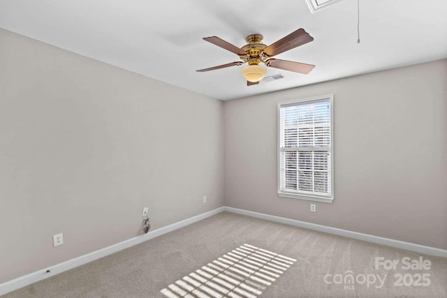 empty room featuring light carpet and ceiling fan