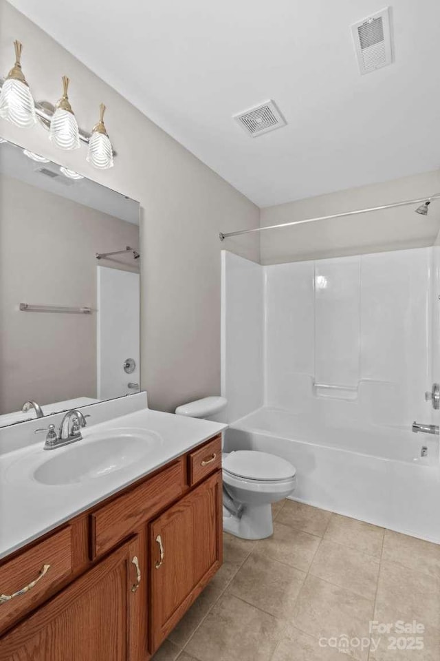 full bathroom featuring vanity, shower / tub combination, tile patterned floors, and toilet