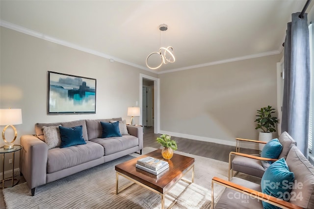 living room featuring a chandelier, ornamental molding, and hardwood / wood-style flooring