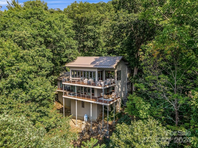 219 Old Toll Rd, Asheville, NC 28804 - back of house featuring a forest view, metal roof, and a deck