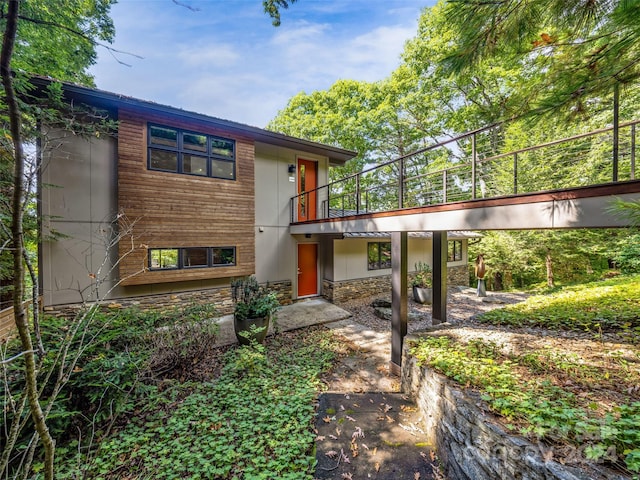 219 Old Toll Rd, Asheville, NC 28804 - rear view of property with a patio area, a balcony, and stone siding