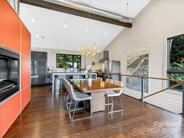 dining room with beam ceiling, dark hardwood / wood-style flooring, high vaulted ceiling, and a chandelier