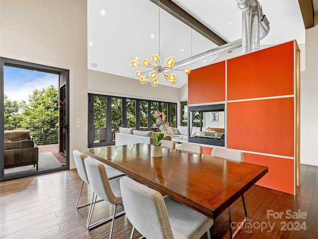 219 Old Toll Rd, Asheville, NC 28804 - dining space with an inviting chandelier, wood finished floors, high vaulted ceiling, and beamed ceiling