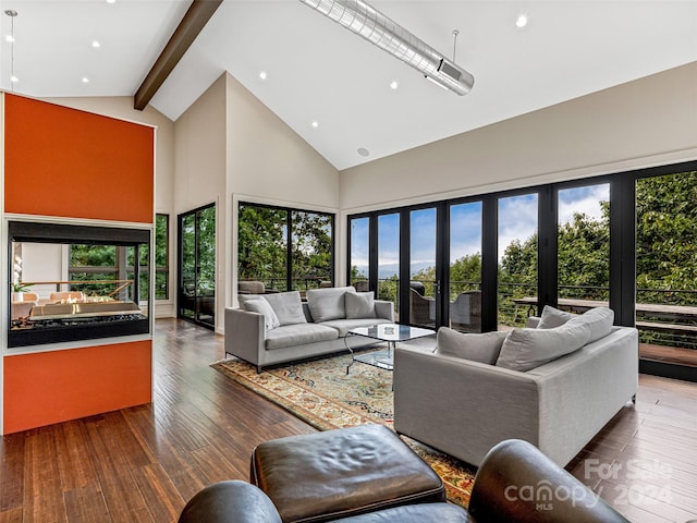 living room featuring beam ceiling, dark hardwood / wood-style flooring, french doors, and high vaulted ceiling