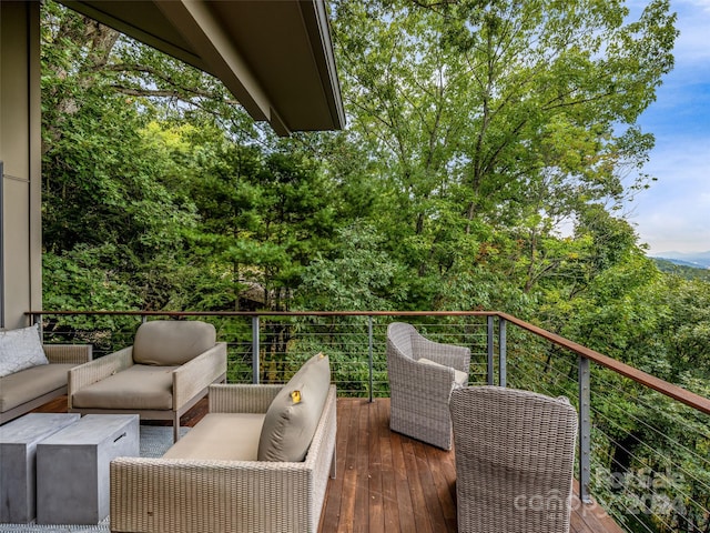 wooden deck with an outdoor hangout area