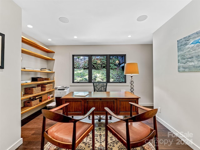 office space with dark wood-type flooring